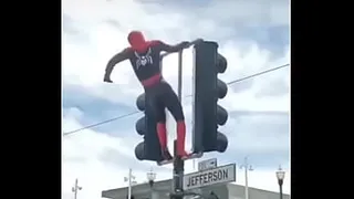 SPIDER MAN SWINGING YUMMY ON THE SIGN