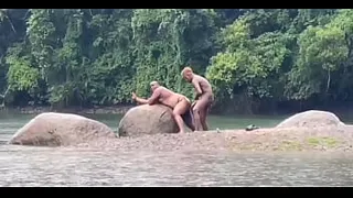 Fucking in the river in the rain with a hot bear and another hottie