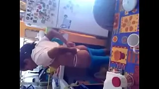 Woman showing her tits in the kitchen