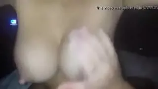Busty girl pouring milk