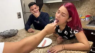 In front of her Silly Husband the Wife Sucks the Sausage that her Friend gives her in a Depraved way She cannot control the pleasure of becoming a NTR Whore