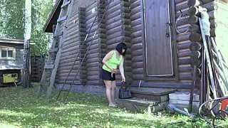 Anal penetration outdoors. MILF in a short skirt without panties fucks her ass in a public place.