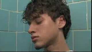 Young people making out in the bathroom
