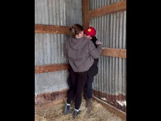 Lesbian Farmers Kiss, Intimate Touch in Barn