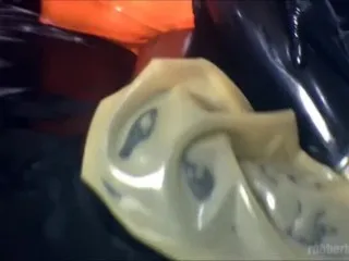 Latex Layered Doll POV On Rubber Bed